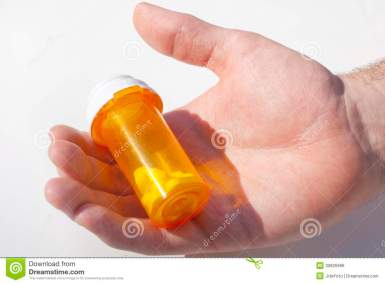 pill-bottle-hand-holding-prescription-30826996